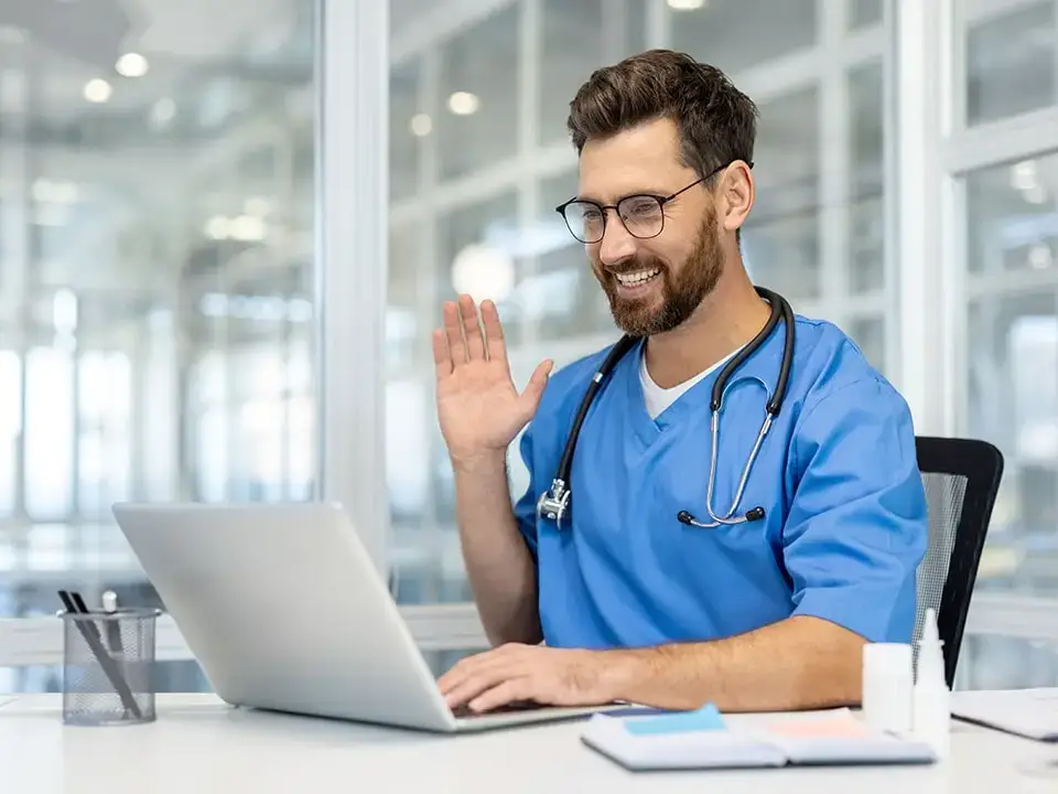 Male nurse chatting with a patient